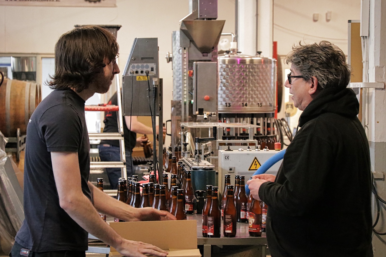 Rob Bours (to the right), head brewer and co-founder of 100 Watt Brewery 