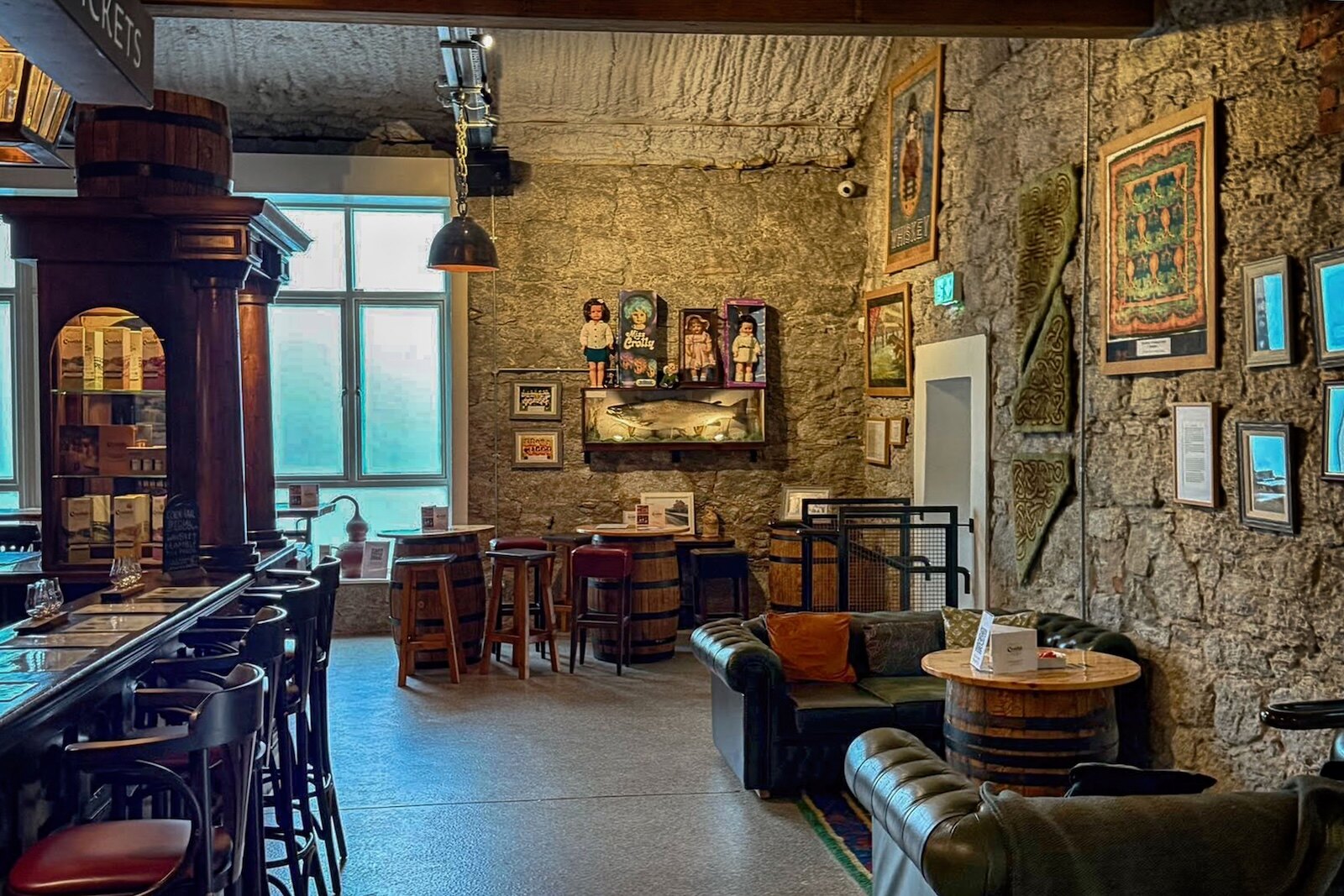 Bar at Crolly Distillery with some famous Crolly dolls in the background