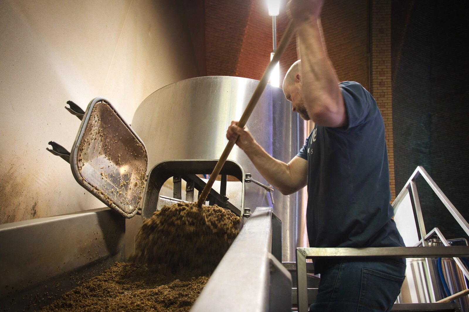 Spent grain is transported outside through a chute
