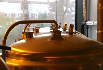 The shiny copper brew kettles